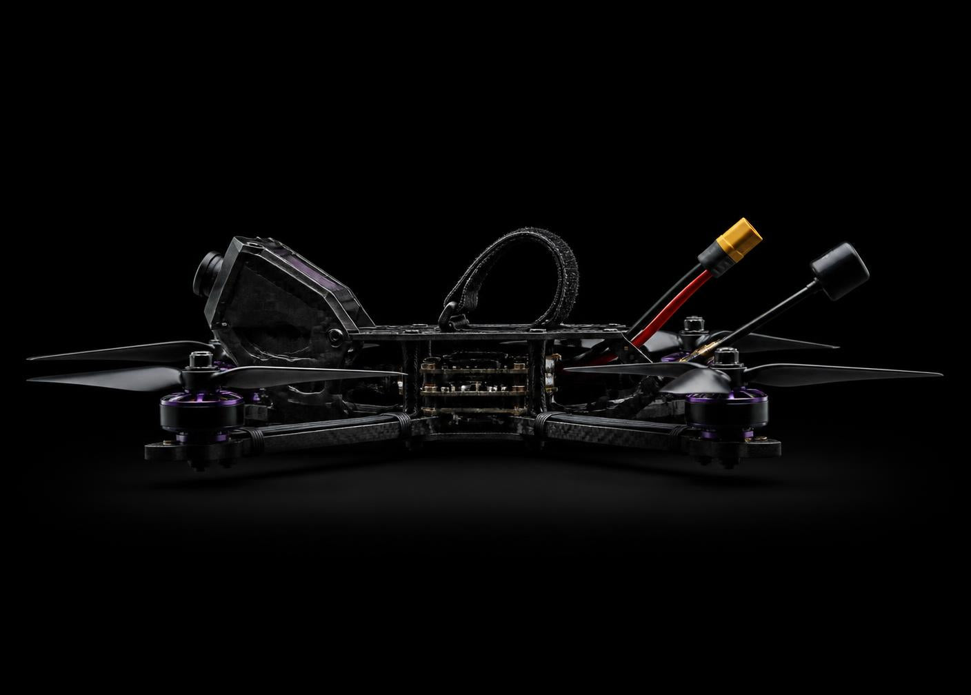Side profile of a complete carbon fibre freestyle FPV drone